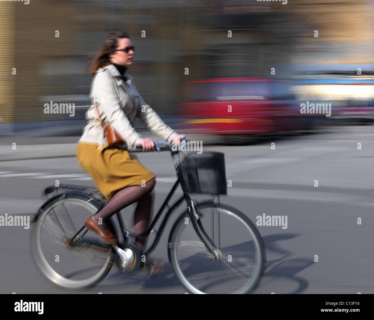 lady riding bicycle in the city of Copenhagen Denmark Stock Photo