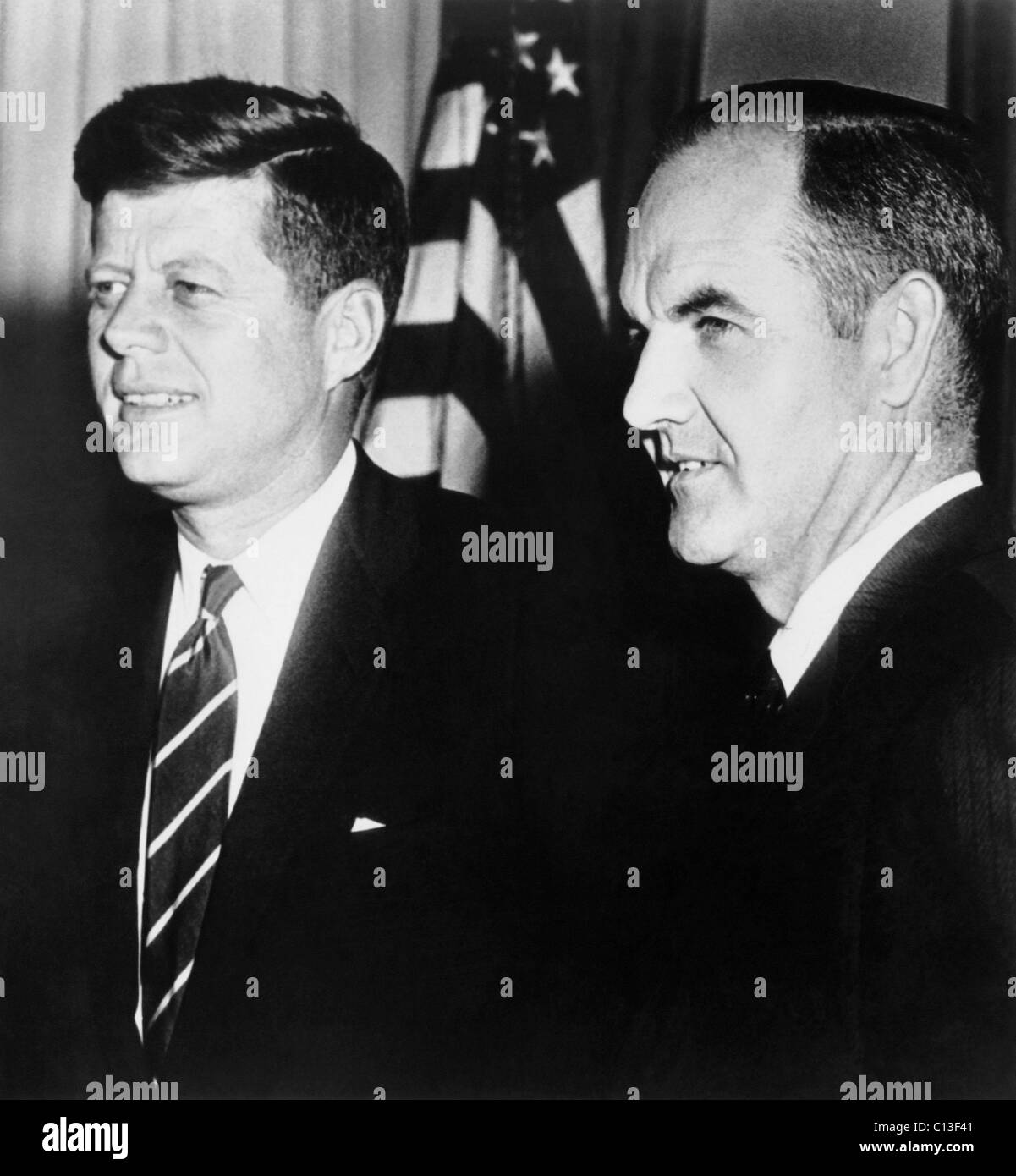 From left, President John F. Kennedy, Senator George McGovern, ca. 1960-63 Stock Photo