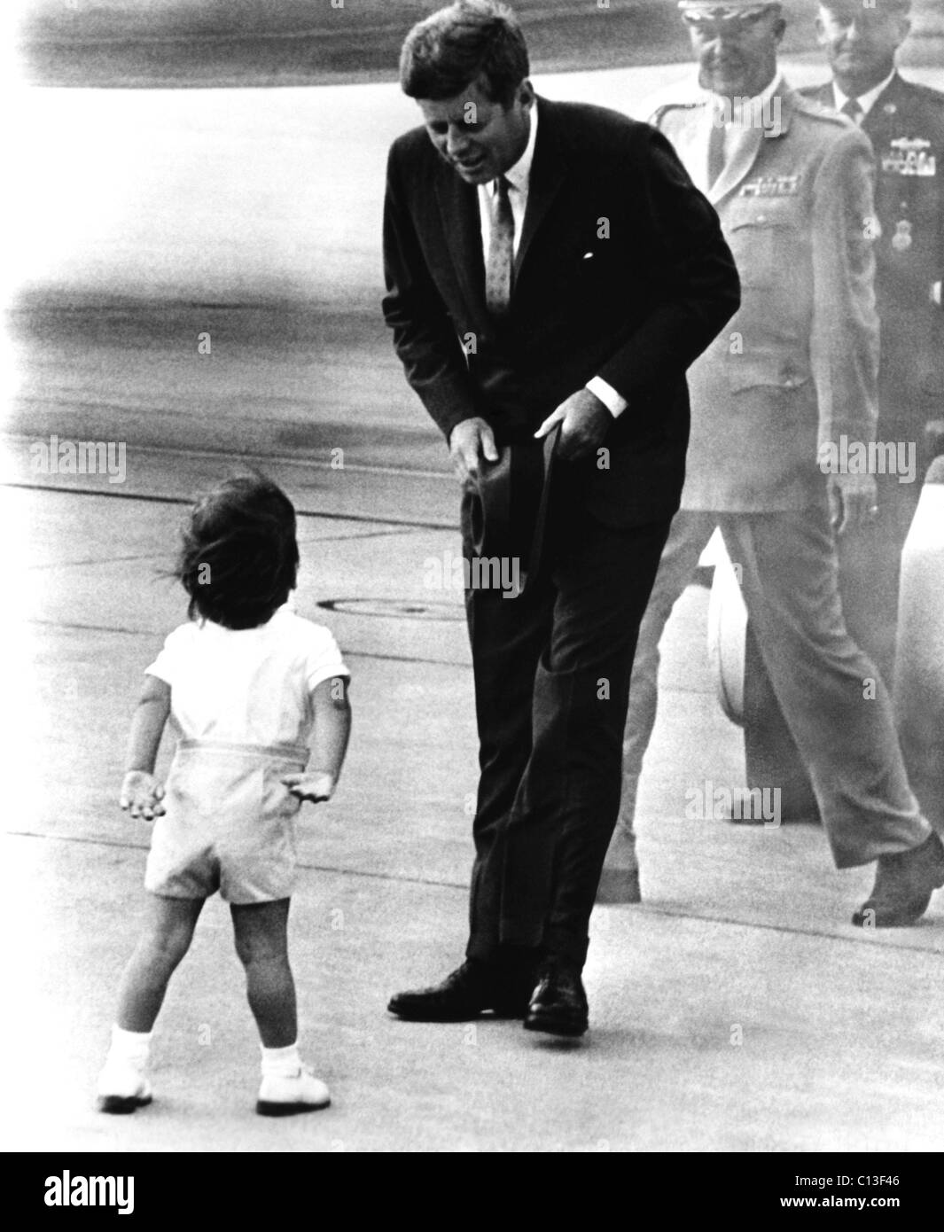 President John F. Kennedy, being greeted by his son, John F. Kennedy, Jr., ca. 1963 Stock Photo