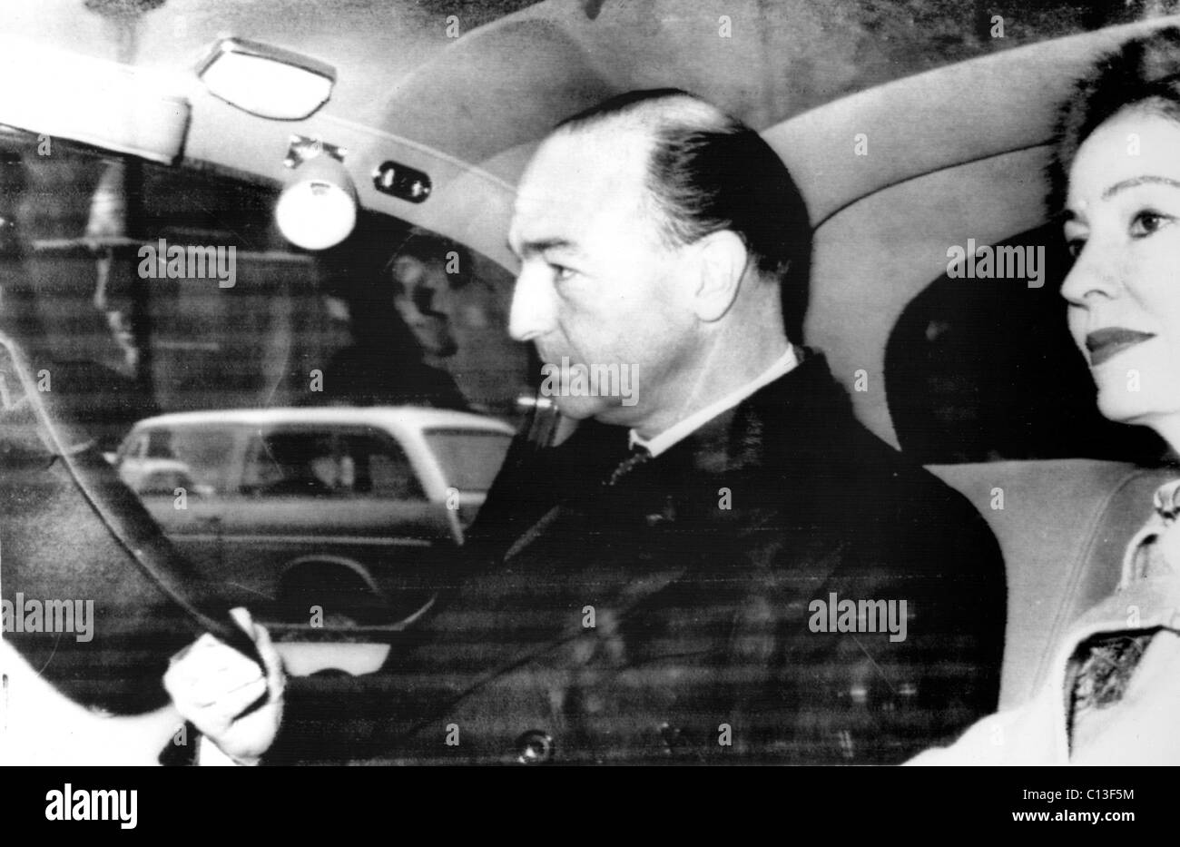 British Minister of War John Profumo and wife Valerie Hobson arrive at Parliament where Profumo would make a personal statement Stock Photo