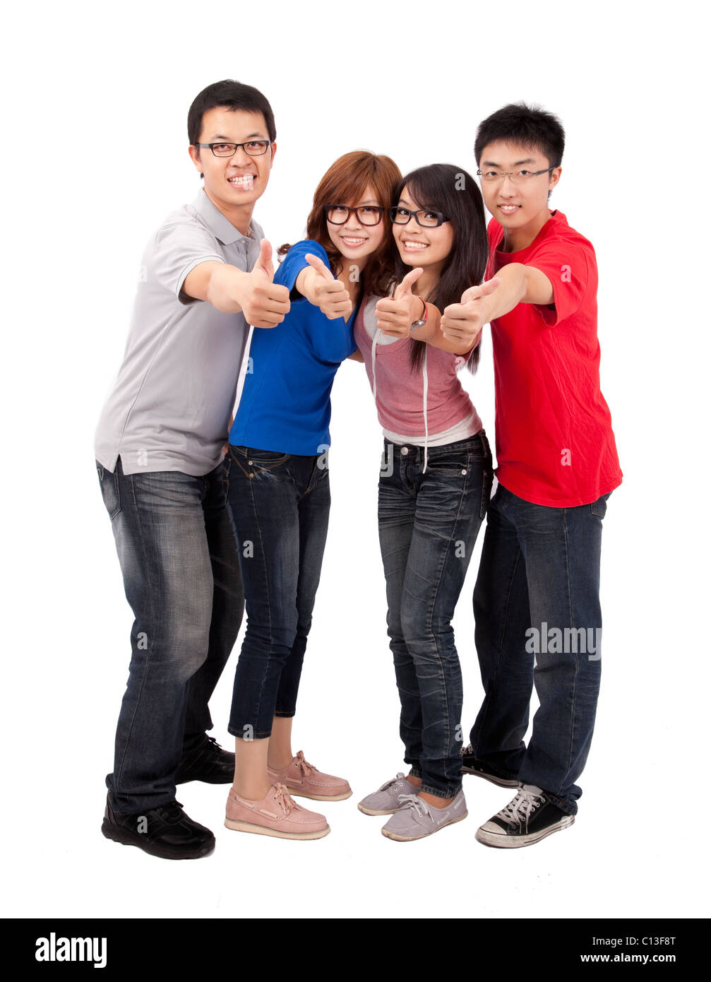 Four happy young student with thumb up Stock Photo