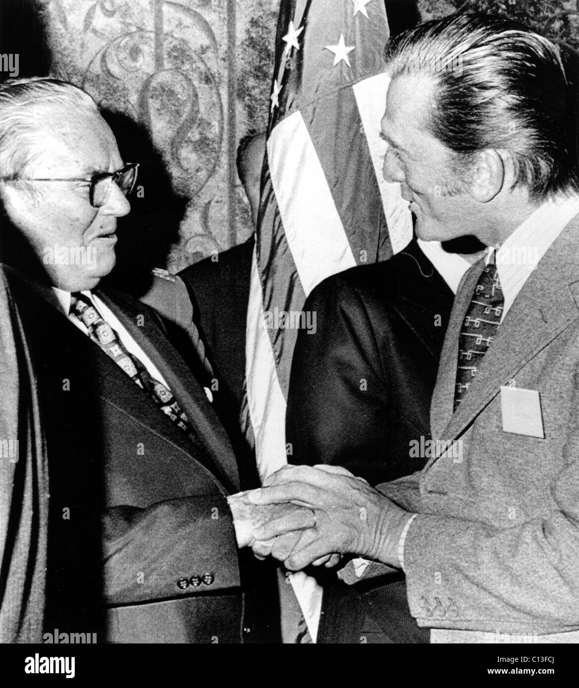 Yugoslavian President Josip Broz Tito shakes hands with Kirk Douglas at a reception in Hollywood for Tito. November 1, 1971 Stock Photo