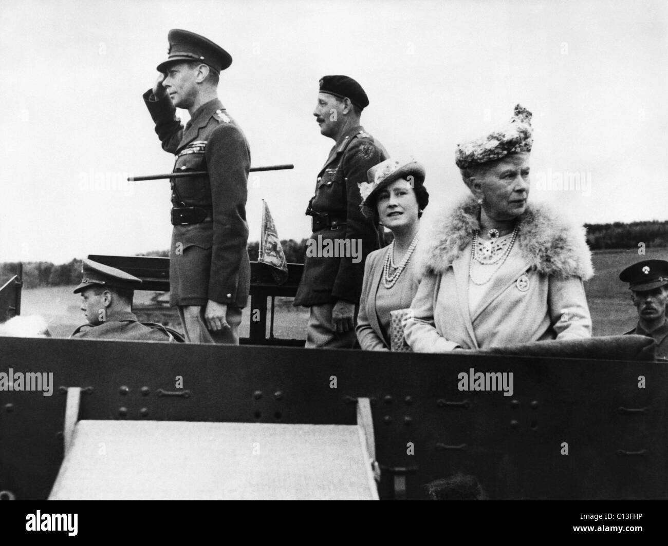 World War II. Left, saluting British King VI of England. Seated
