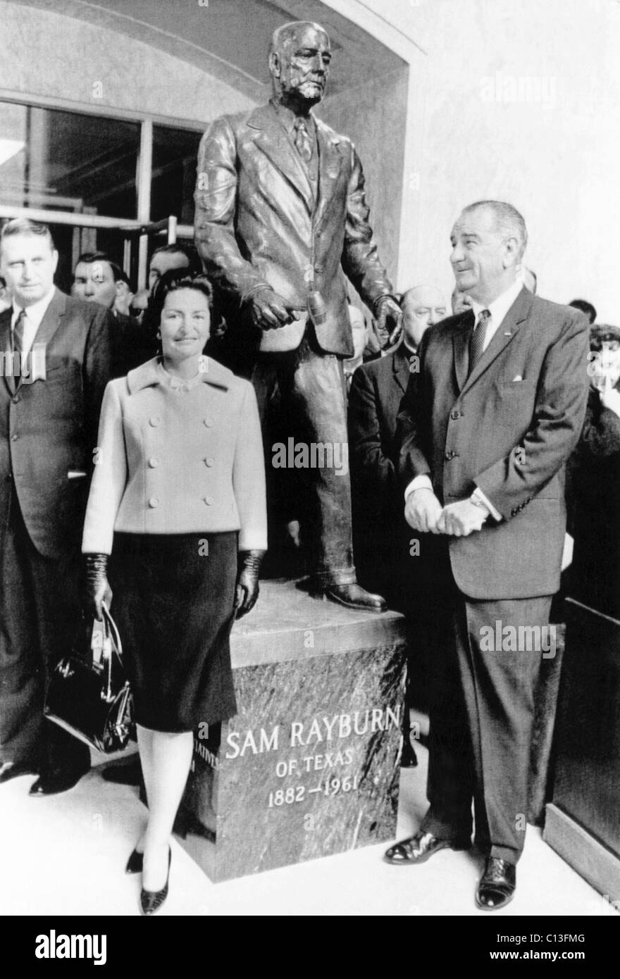 Foreground from left: First Lady Lady Bird Johnson and President Lyndon B. Johnson at the dedication ceremony of a statue of the late Speaker of the House Sam Rayburn. The statue at the Rayburn House Office Building is the work of sculptor Felix de Weldon. Washington, DC, January 6, 1965 Stock Photo