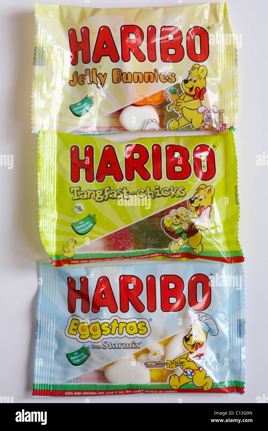 Packets of Haribo Easter sweets - Jelly Bunnies, Tangfast-chicks and Eggstras sweets for Easter on white background Stock Photo