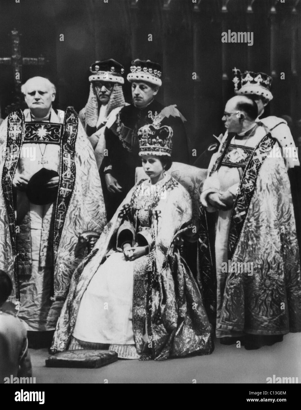 British Royalty. Front row, from left: Bishop of Durham Arthur Michael Ramsey, Queen Elizabeth II of England, Bishop of Bath and Wells Harold William Bradfield, during the Queen's coronation, Westminster Abbey, London, England, June 2, 1953. Stock Photo