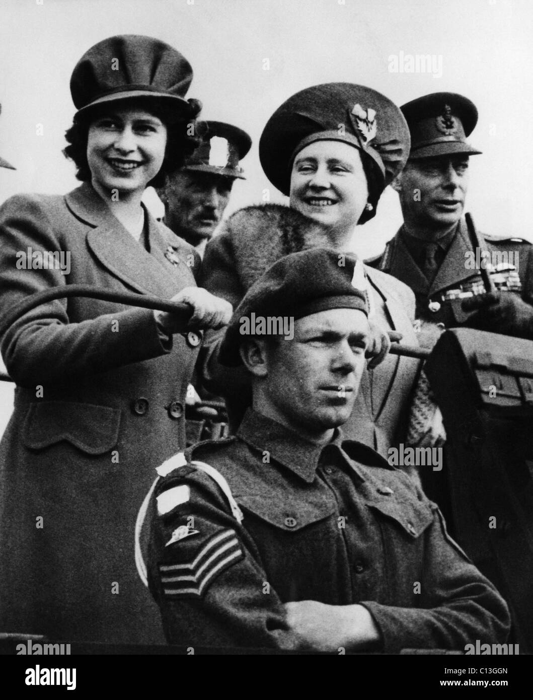 World War II. Back row, from left: Future Queen of England Princess Elizabeth, Queen Mother Elizabeth, King George VI, during a Stock Photo