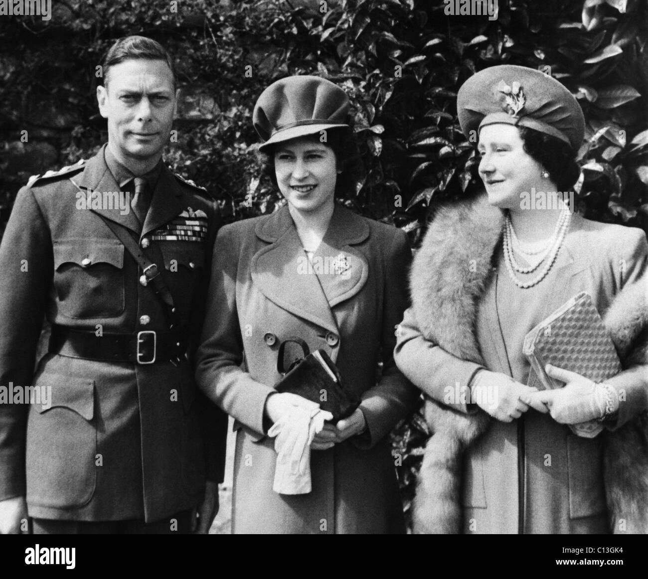 British Royal Family. From left: British King George VI, Future British Queen Princess Elizabeth, British Queen Elizabeth (future Queen Mother), on the Princess' 18th birthday, April 21, 1944. Stock Photo