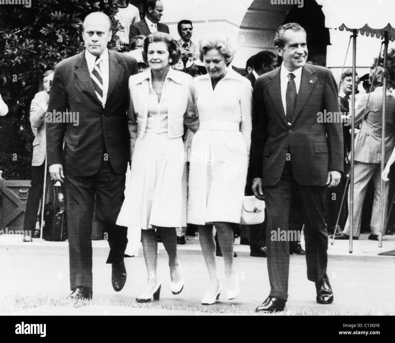 Gerald Ford Inauguration. From left: US President-Elect Gerald Ford and future First Lady Betty Ford walk with First Lady Patricia Nixon and President Richard Nixon shortly before Ford was sworn in as President, Washington, D.C., August 9th, 1974. Stock Photo
