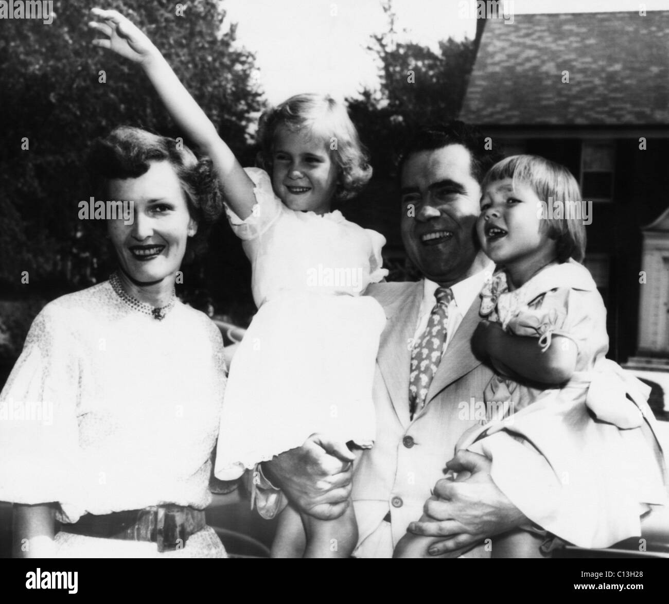1952 Presidential Campaign, Nixon Family. From left: Patricia Nixon (future First Lady), Tricia Nixon, Senator (and future US President) Richard Nixon, and Julie Nixon, shortly after Nixon was nominated for Vice President, 1952. Stock Photo