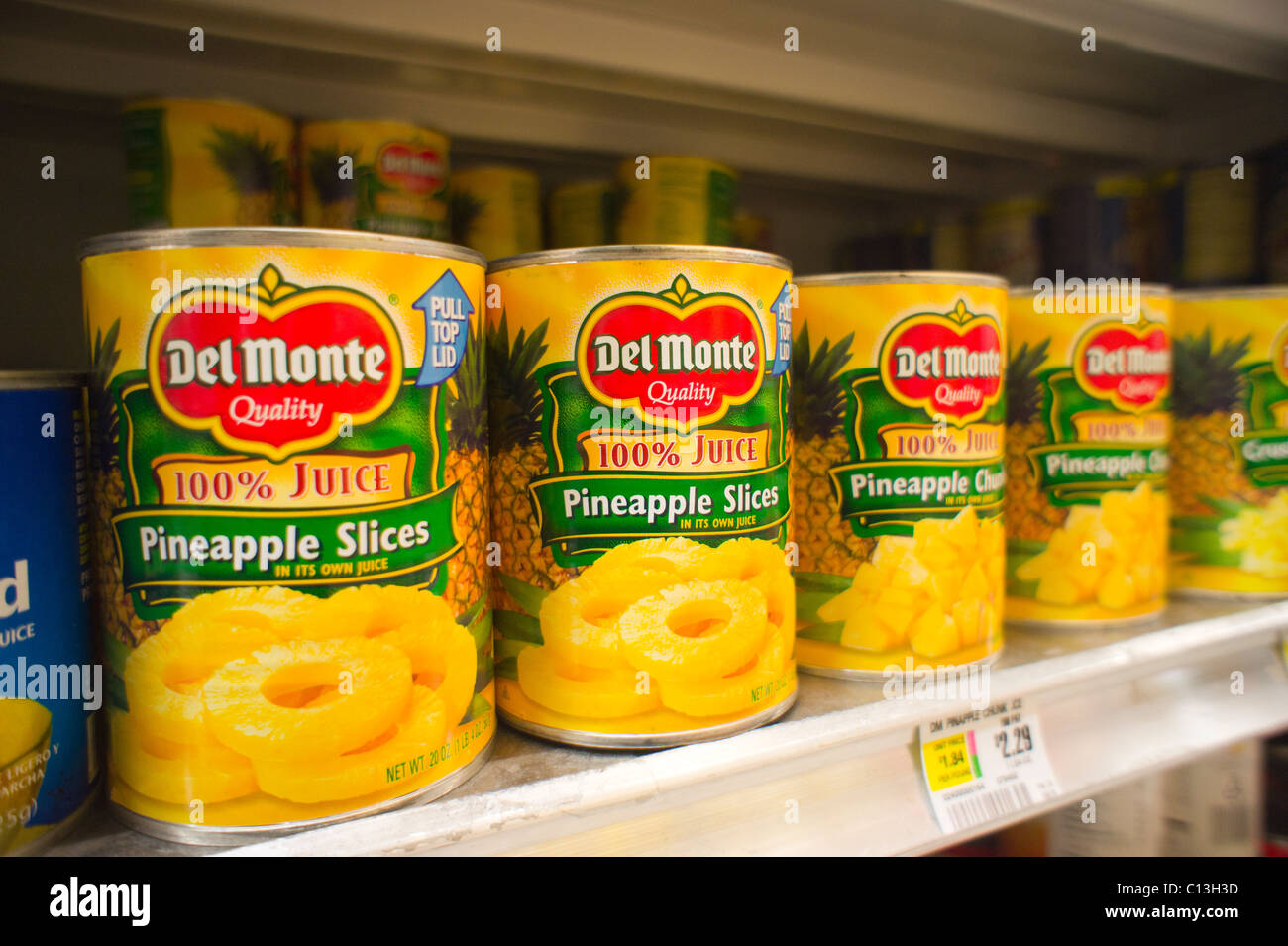 Cans of Del Monte Foods canned fruit are seen on a supermarket shelf in