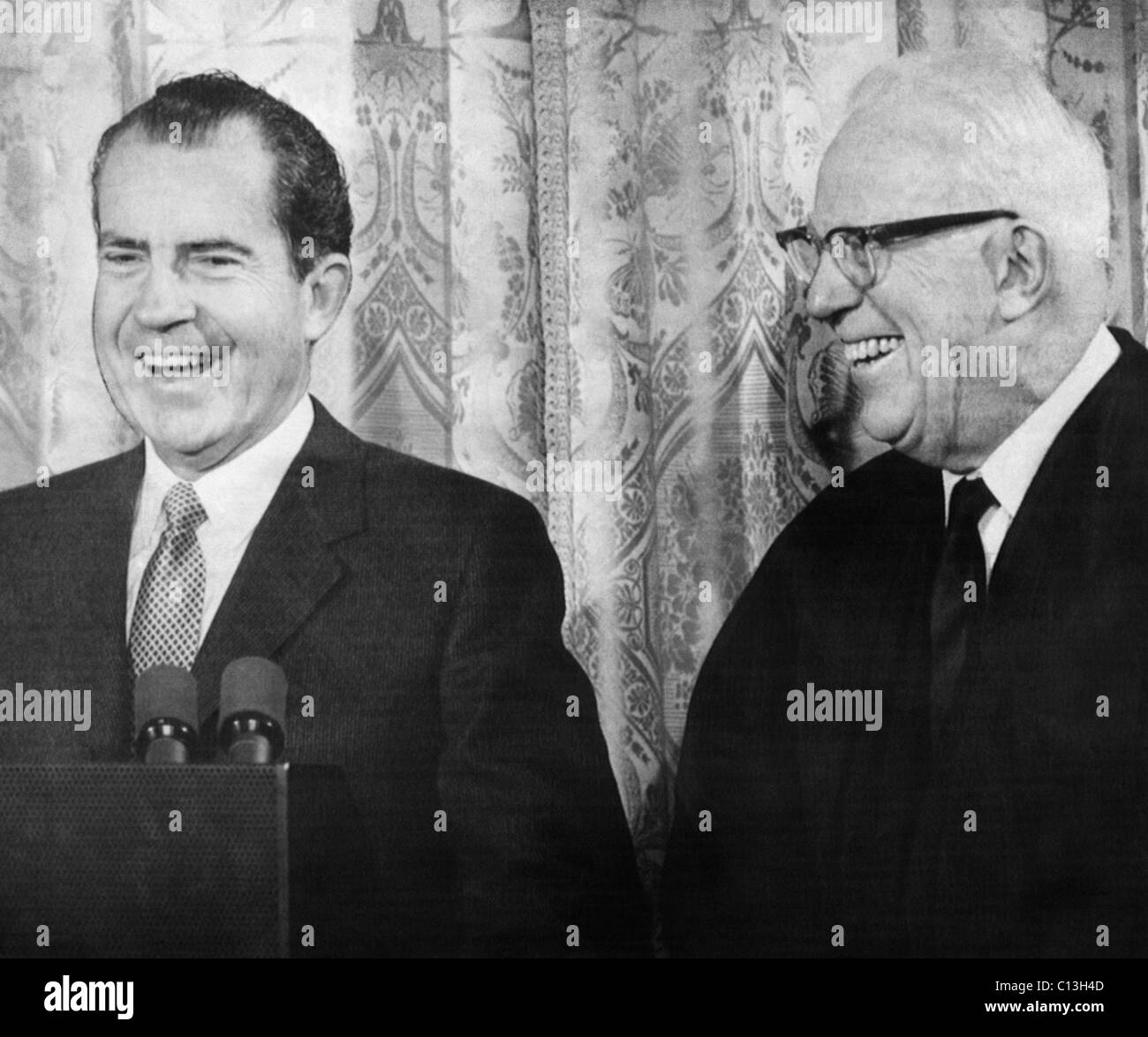 Nixon Presidency. US President Richard Nixon with Chief Justice of the Supreme Court Earl Warren, who was invited to swear in new members of White House staff, Washington, D.C., 1969 Stock Photo