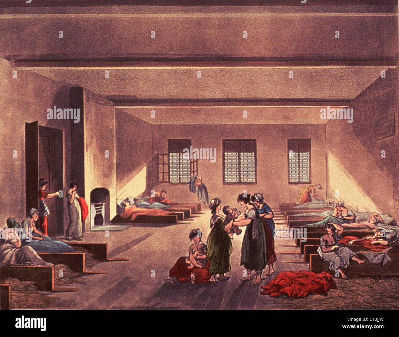 Detention room in London's Bridewell Hospital, for homeless, impoverished, and probably single or unwed mothers. British Poor Law required paupers be returned to their rural parishes, who were responsible for the local care of the poor. Before return, the women paupers and their children were detained in low stalls with hay for bedding. Drawing by Thomas Rowlandson and Augustus Pugin, ca. 1808. Stock Photo