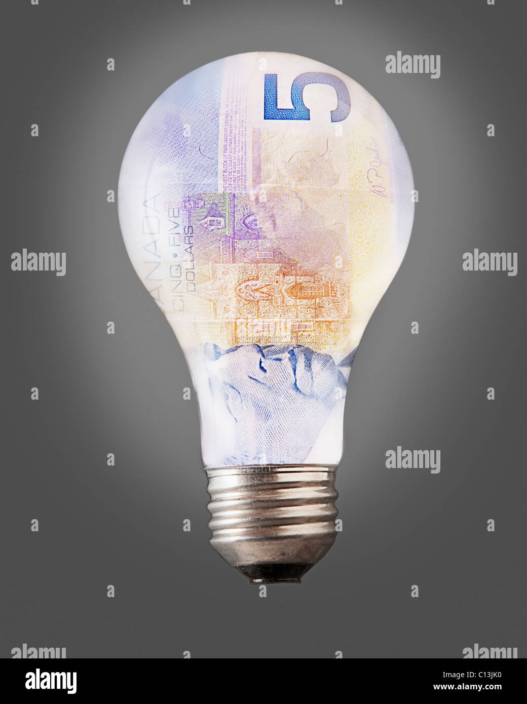 Composition of bulb and five canadian dollar banknote Stock Photo