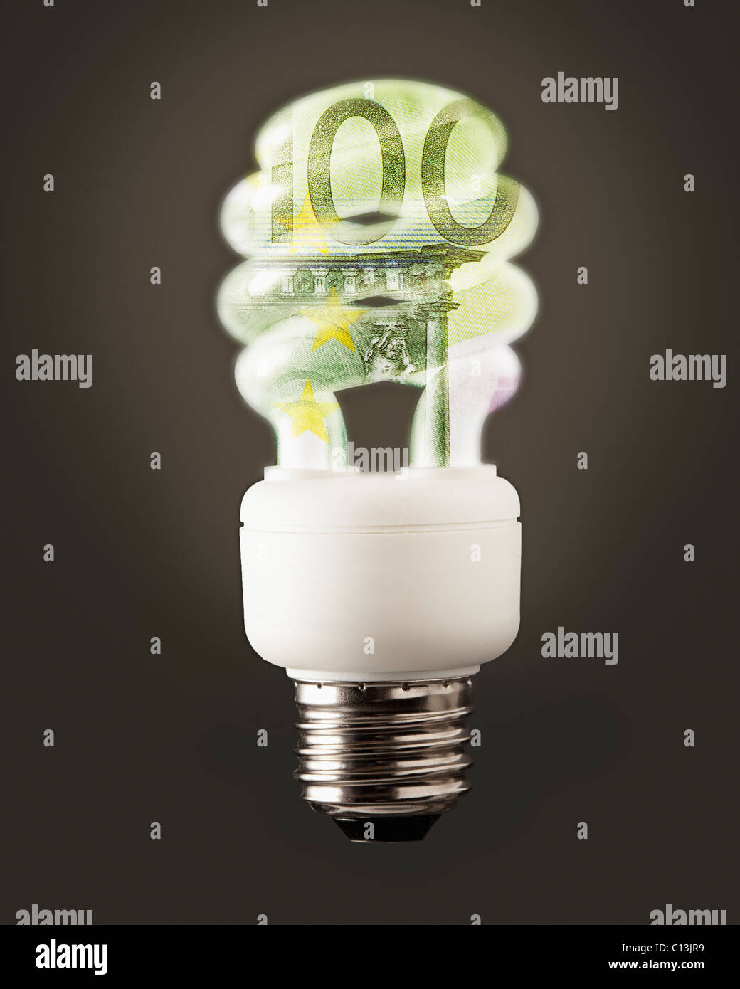 Composition of energy efficient bulb and one hundred euro note Stock Photo