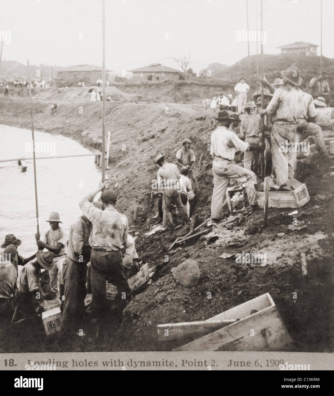 Panama Canal construction showing workers loading holes with dynamite ...