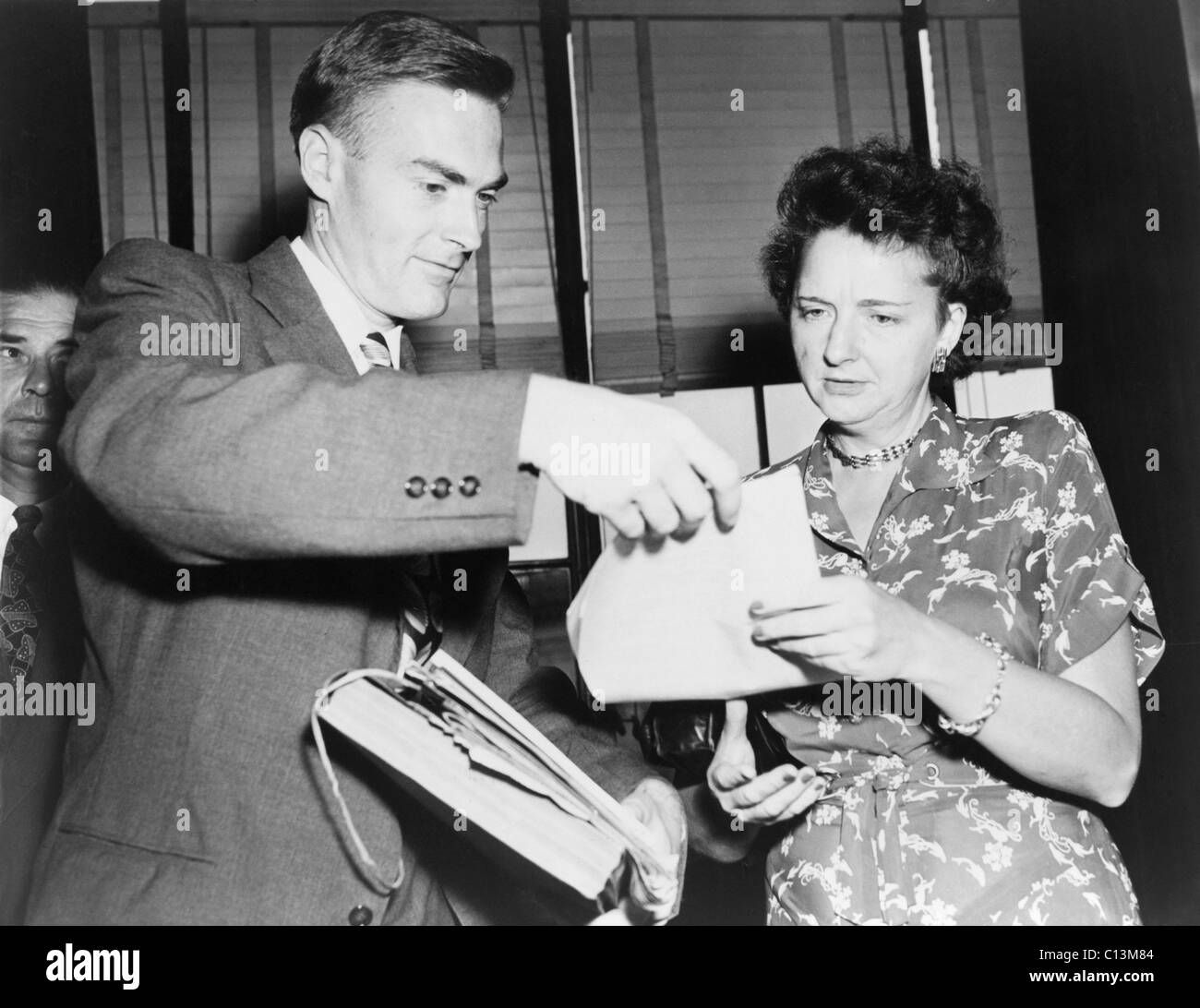 William Remington left U.S. Government economist accused of spying for the Soviet Union during World War II with his accuser Elizabeth T. Bentley in 1948. Remington was convicted of perjury and murdered while in prison. Stock Photo