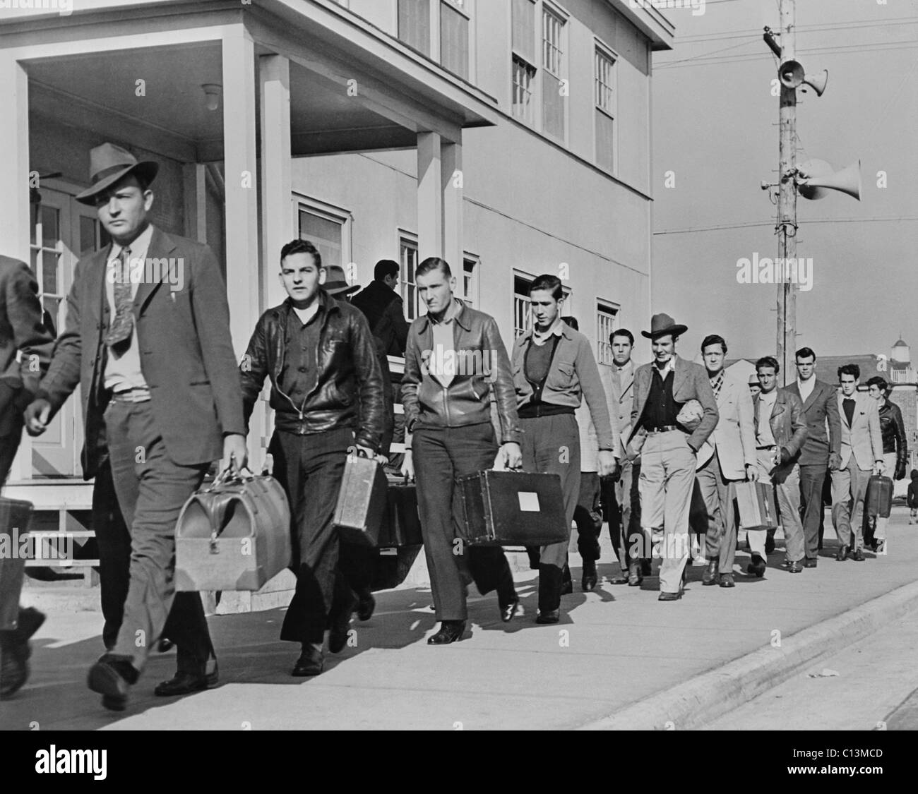 Enrollees from across the country arriving at the United States Maritime Service training station at Sheepshead Bay New York. During World War II the station had 10 000 apprentice seamen in training for the American Merchant Marine. 1943. LC-USW33-026129-C Stock Photo