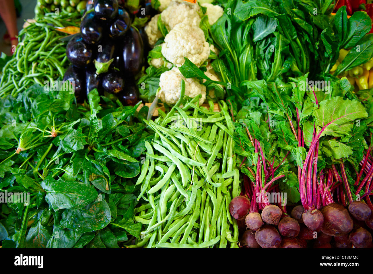 Fresh vegetables on a market stall in a market Stock Photo