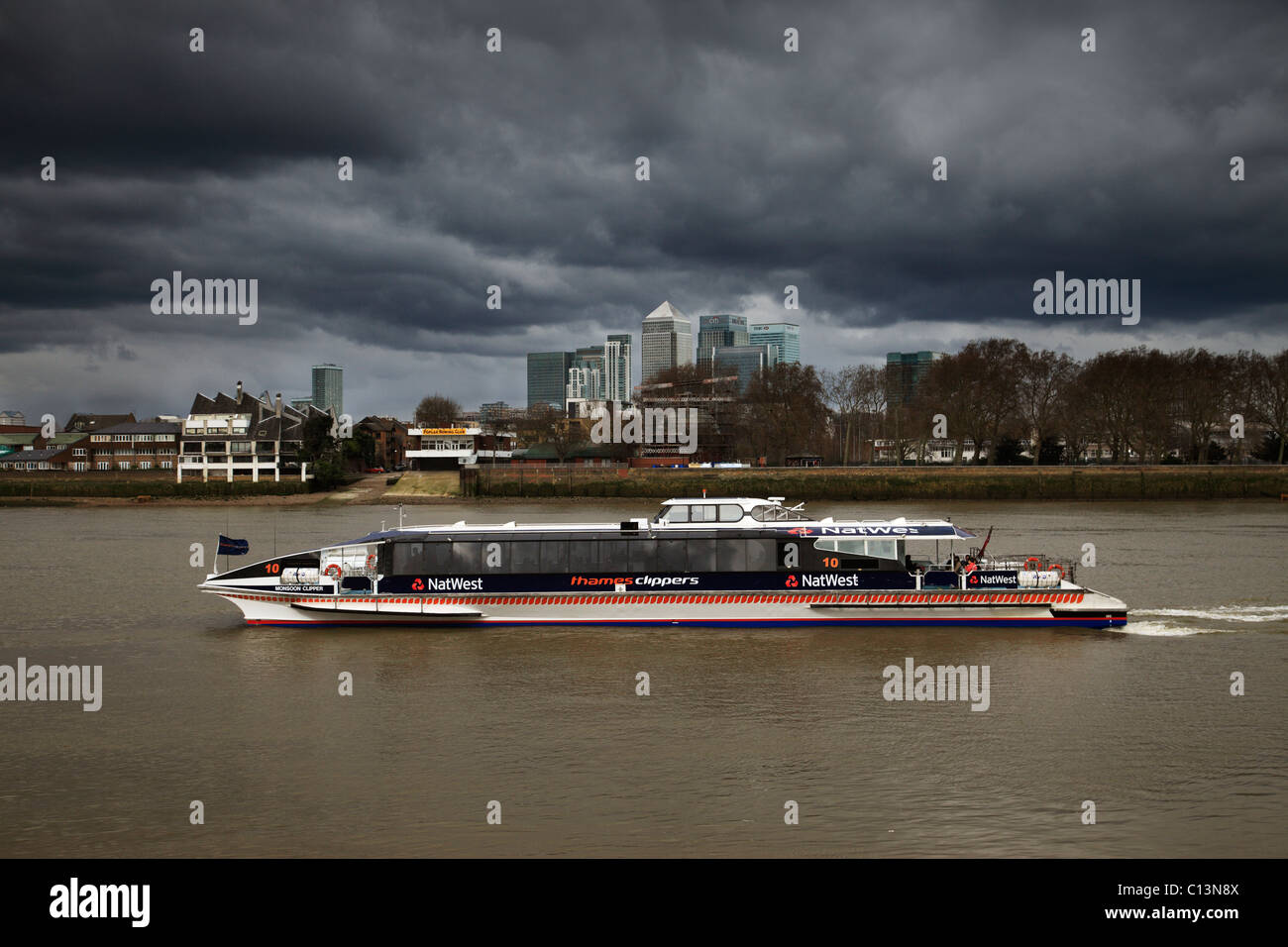 Thames Clipper in approaching storm. Stock Photo