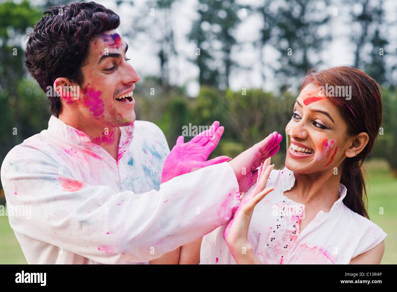 Couple celebrating Holi Stock Photo - Alamy