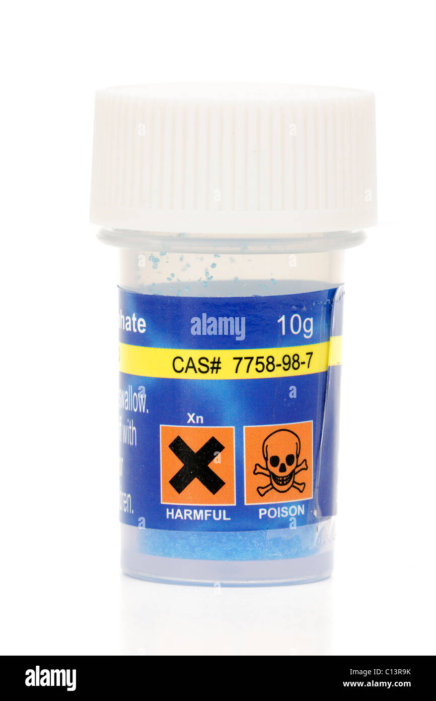 Poison and Harmful warnings on a 10 gram plastic container of Copper Sulphate Stock Photo