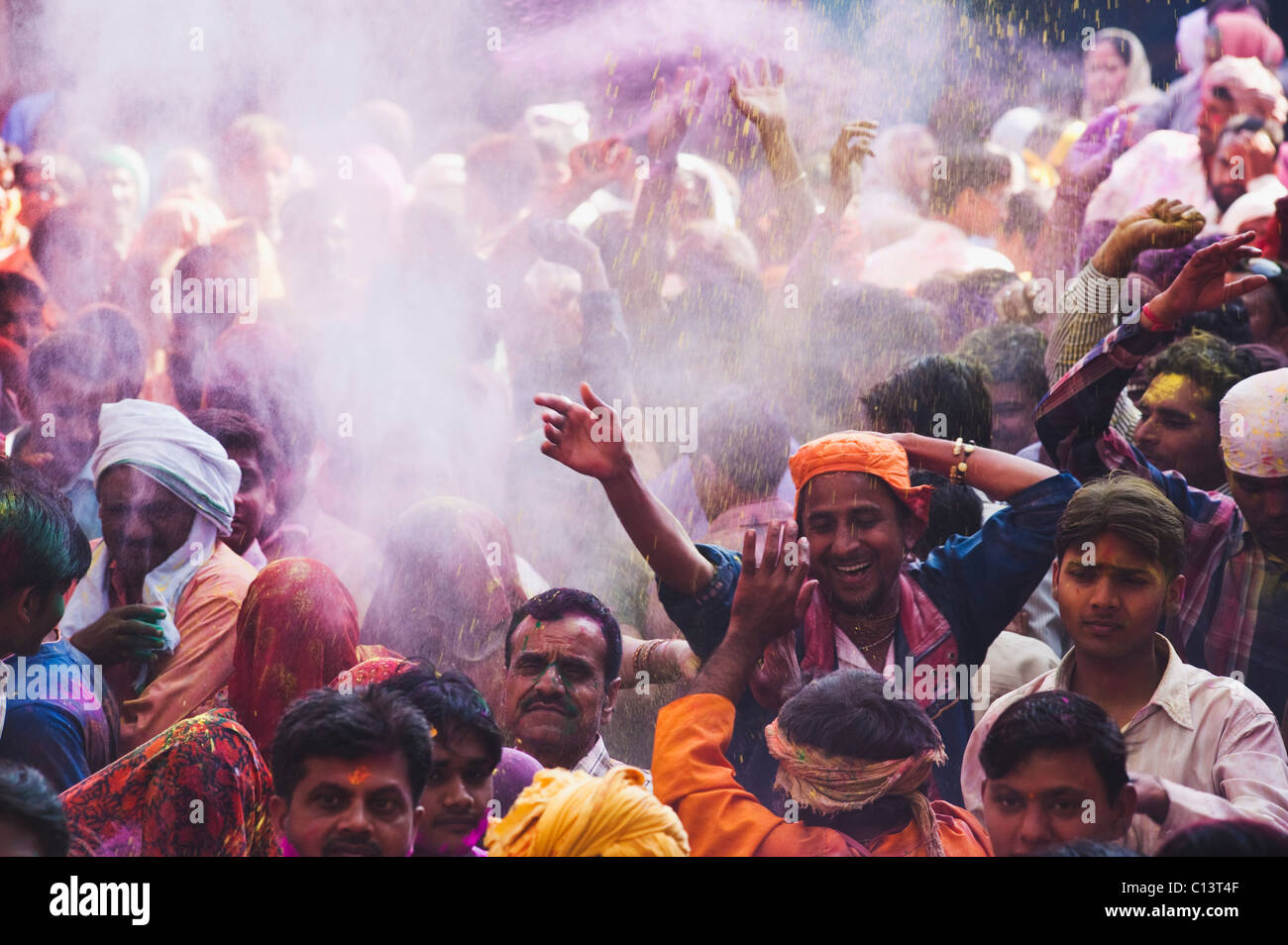 Group of people celebrating Holi festival, Barsana, Uttar Pradesh, India Stock Photo