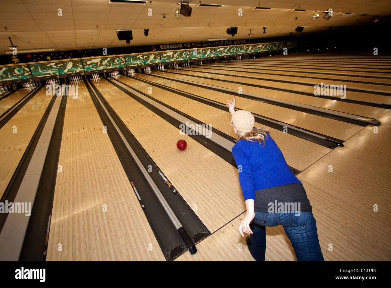A woman bowls a bowling ball in an bowling alley, 12/29/2010 Stock Photo