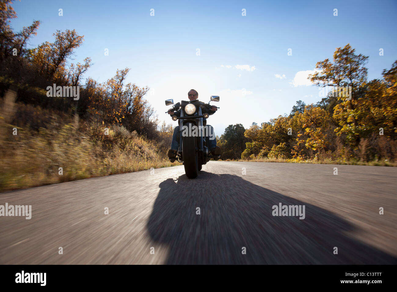 USA, Colorado, Carbondale, Mature man driving motorcycle Stock Photo