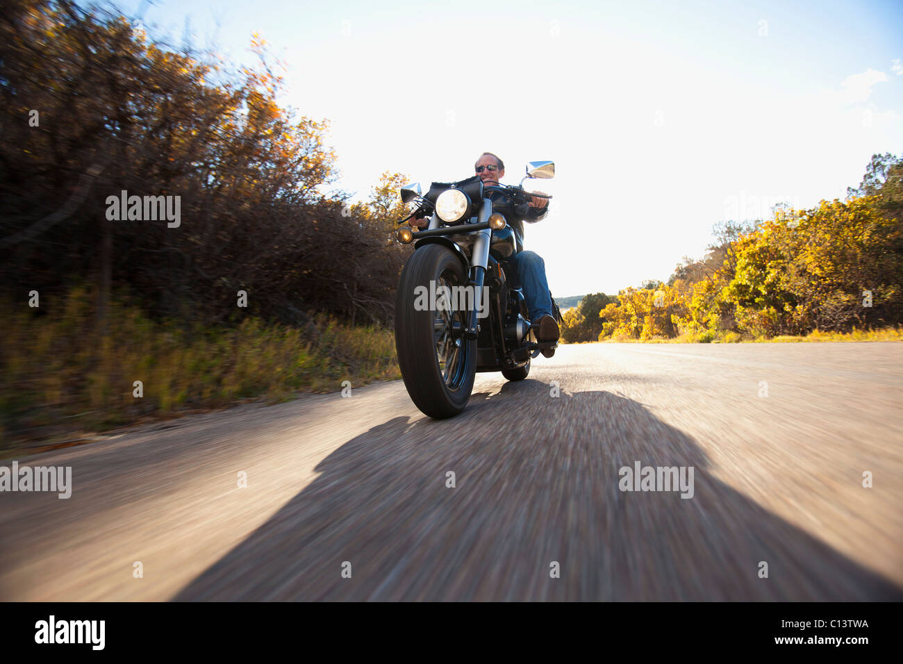 USA, Colorado, Carbondale, Mature man driving motorcycle Stock Photo