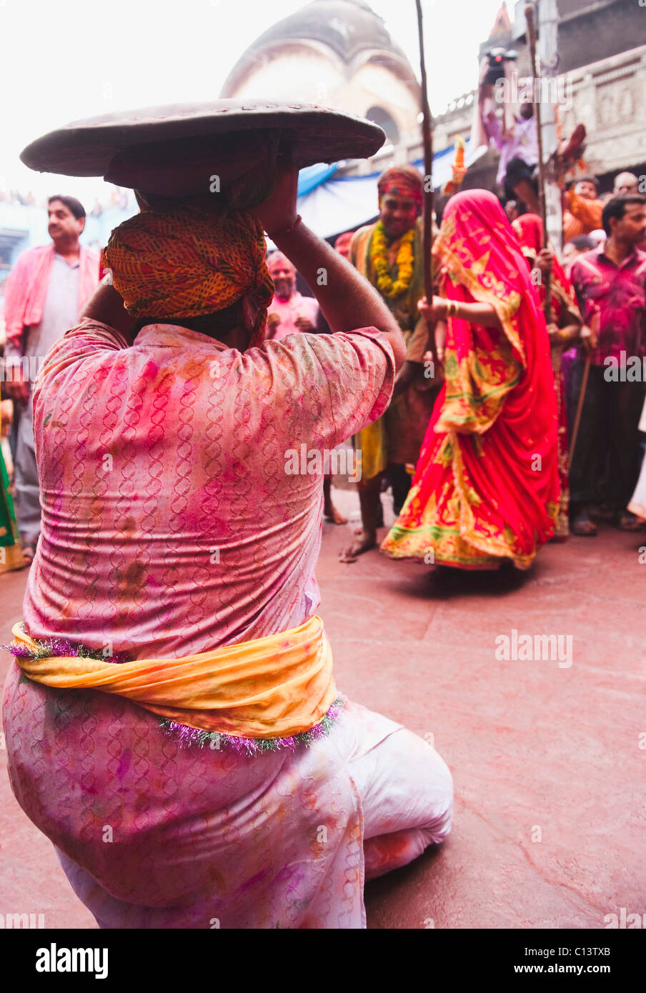 People celebrating 'Lath Maar Holi' festival, Barsana, Uttar Pradesh India Stock Photo