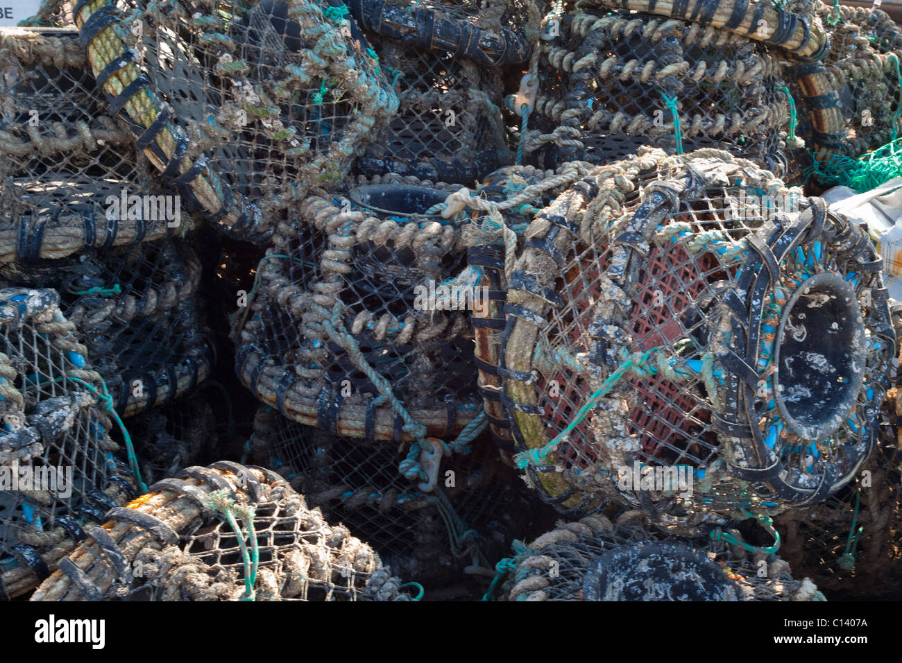 Lobster pots stacked in a haphazard way Stock Photo
