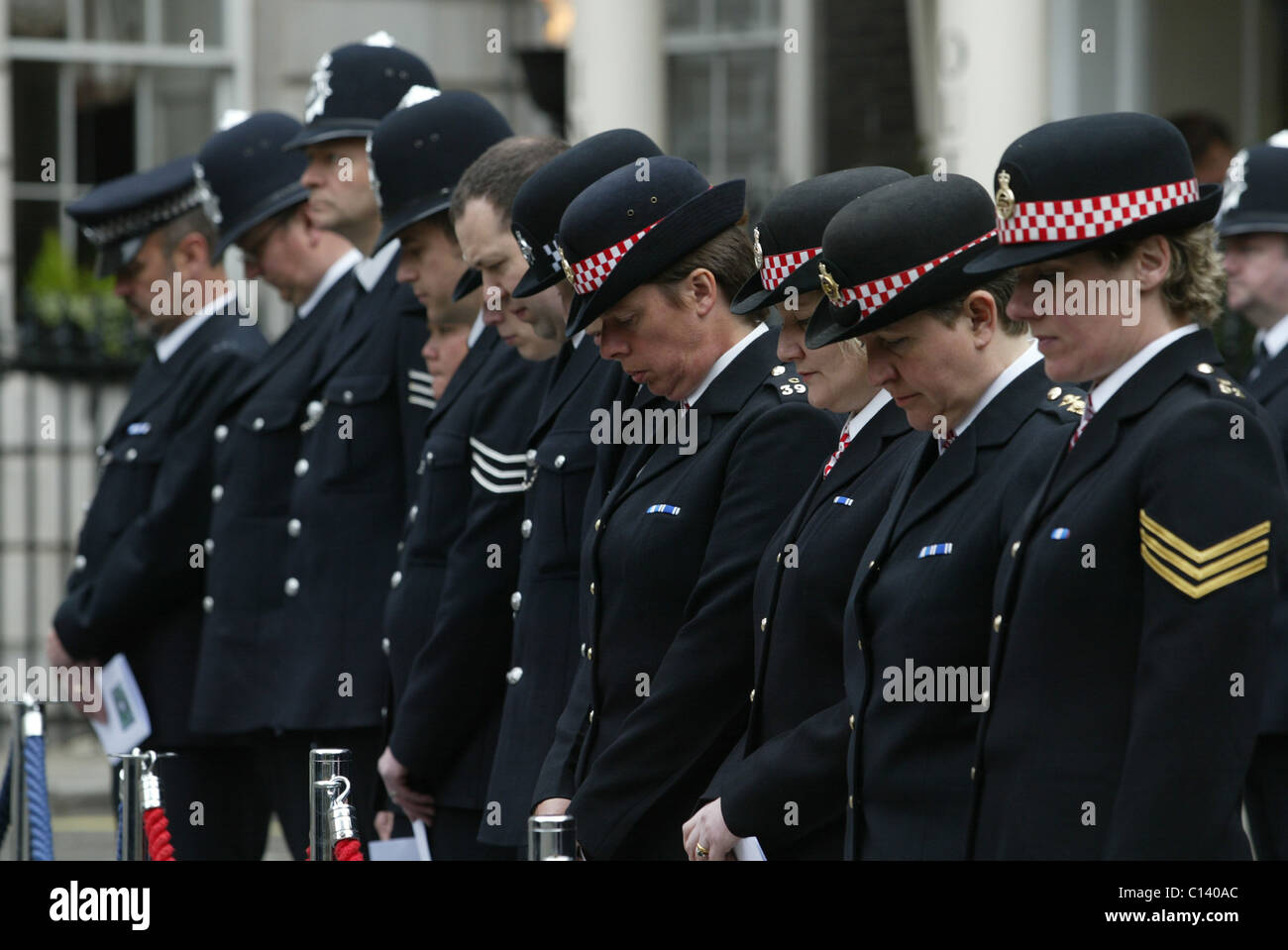 Police officers paying respects at a memorial service to murdered British Policewoman PC Yvonne Fletcher in London Stock Photo