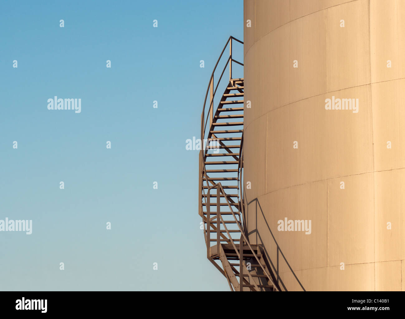 Winding Stairs high on a tower, bathed in sunlight Stock Photo