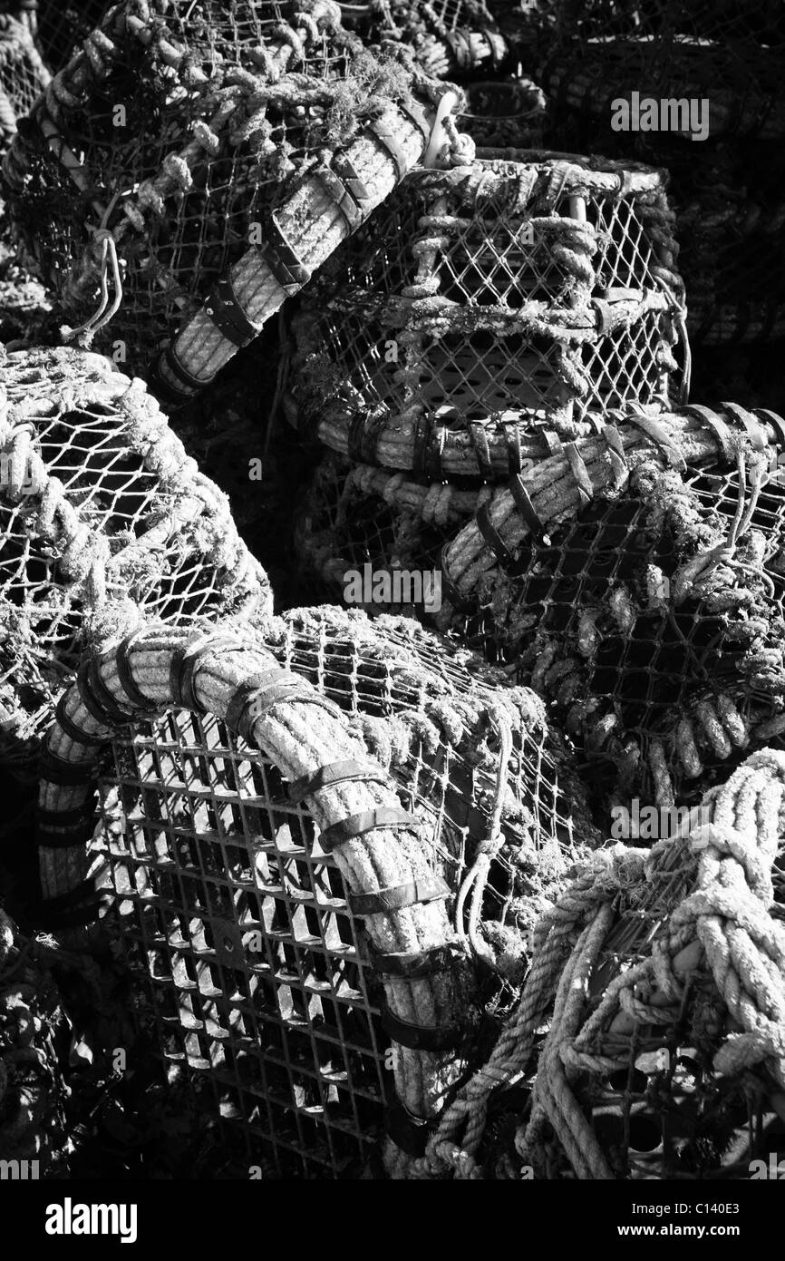 Lobster pots stacked in a haphazard way (Black and White) Stock Photo