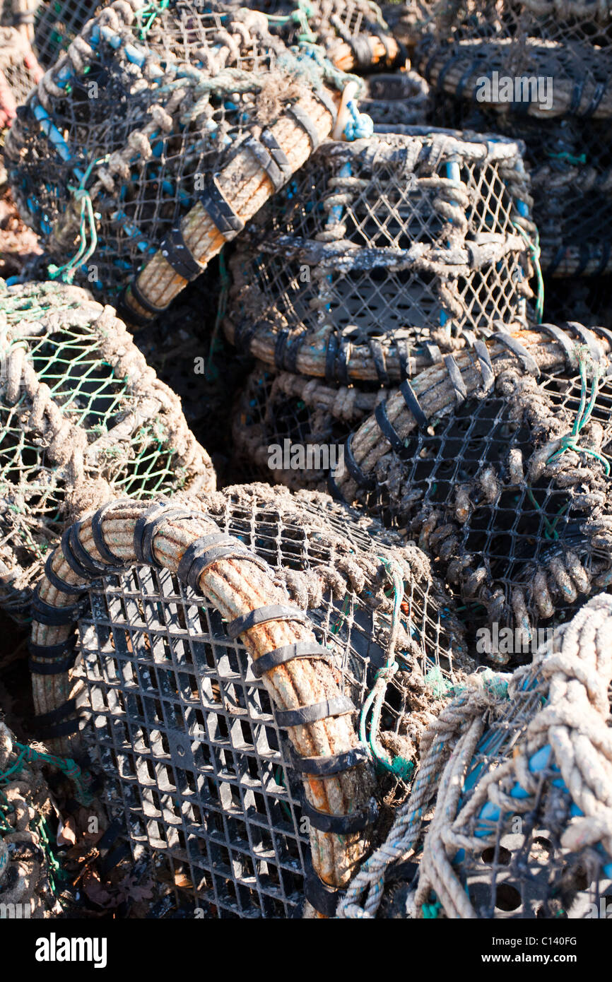 Lobster pots stacked in a haphazard way Stock Photo