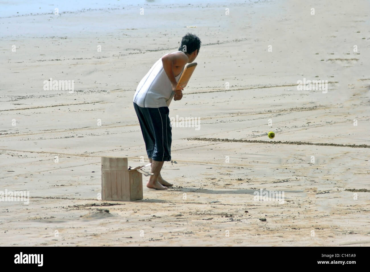 on menori beach, batsmen about to hit the ball over the boundry Stock Photo