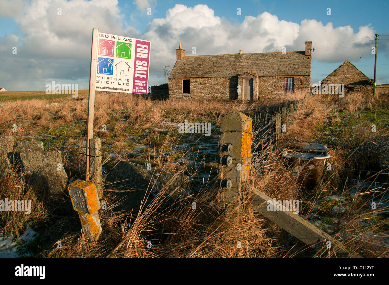 Abandoned cottage with 'for sale' sign, near Scarfskerry, Caithness
