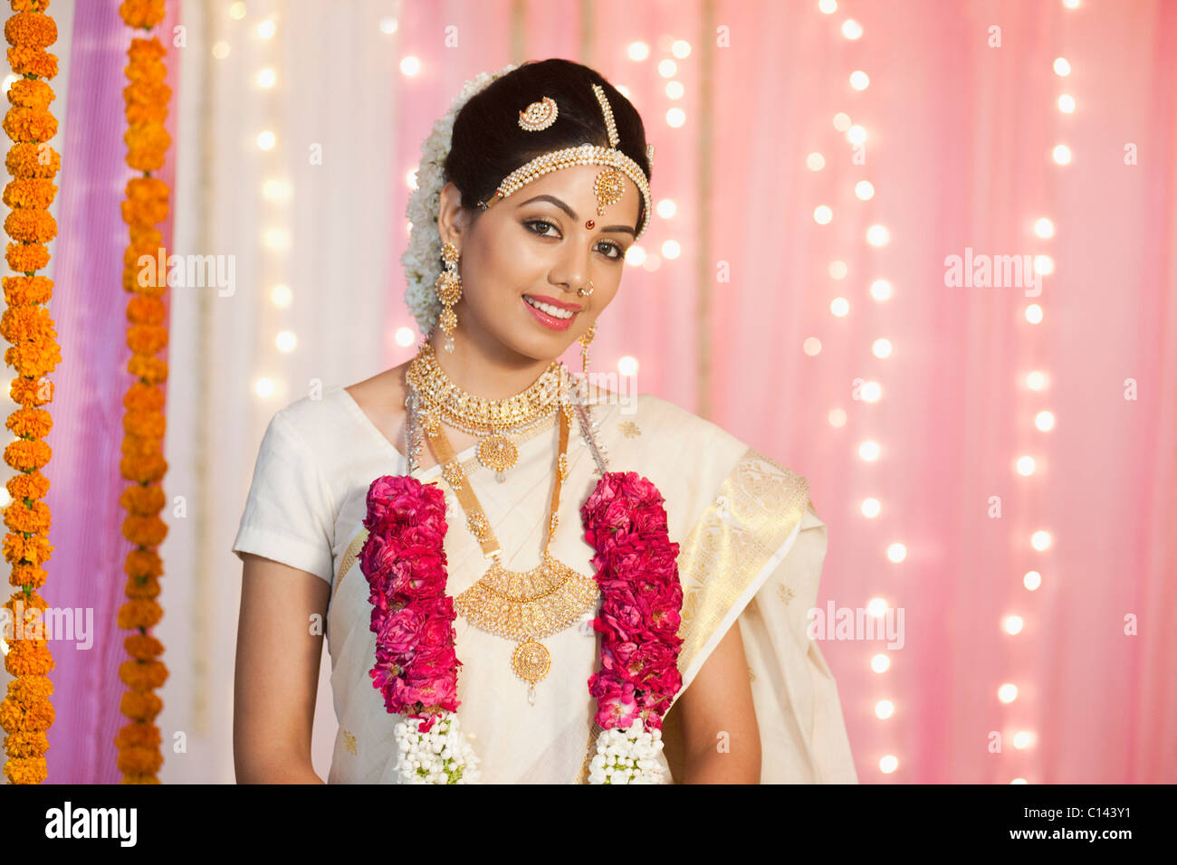 Portrait of a bride in traditional South Indian dress smiling Stock Photo