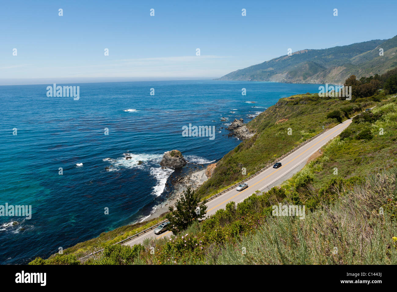 California Highway 1 winds along the Big Sur coastline with view of the ...