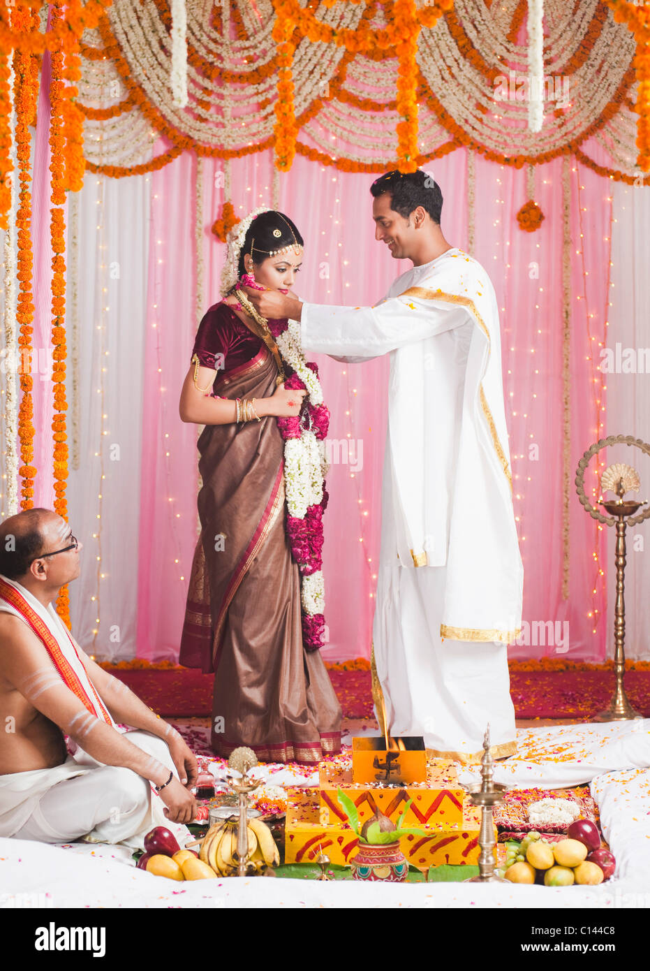 Bride And Bridegroom During Exchanging Of Garlands Ceremony At