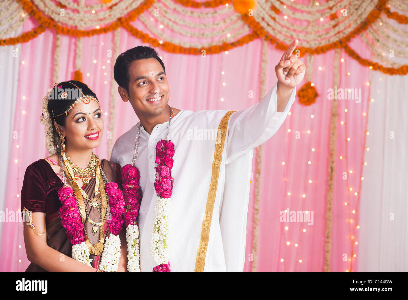 Bridegroom showing Arundhati and Dhruva Star to a bride and smiling Stock Photo