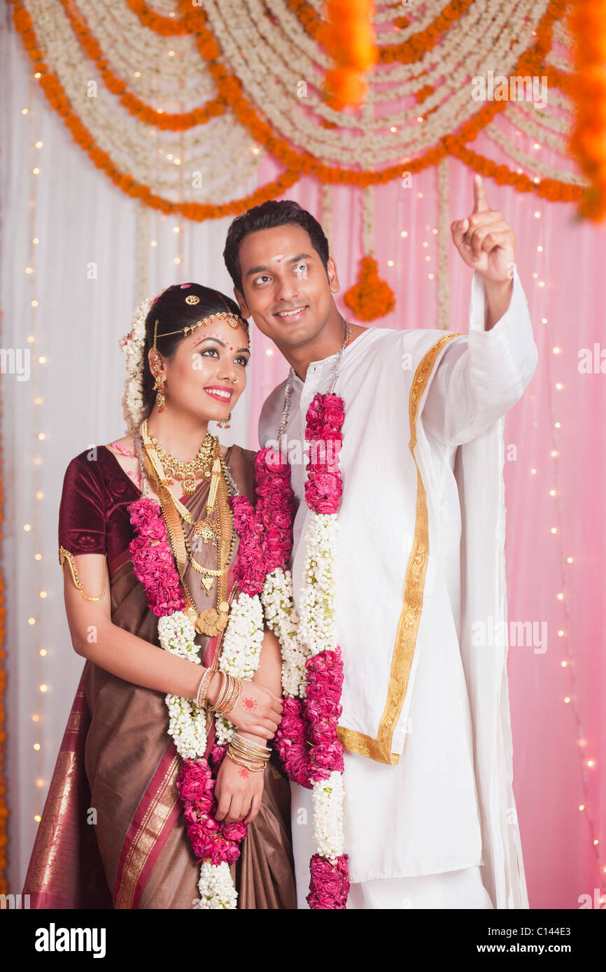 Bridegroom showing Arundhati and Dhruva Star to a bride and smiling Stock Photo