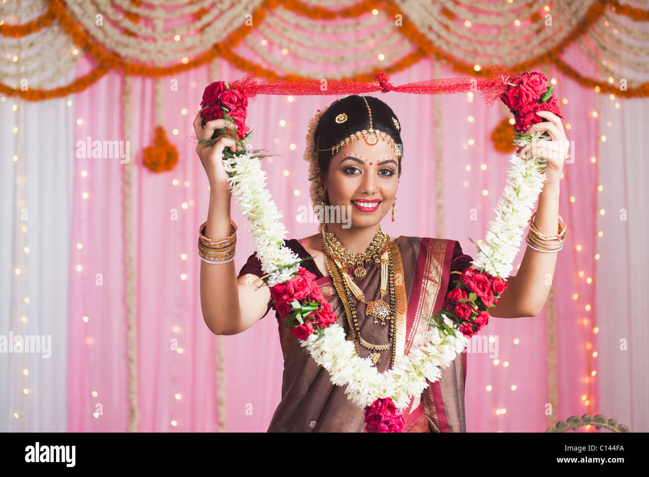 Portrait Of A Bride In Traditional South Indian Dress Holding A