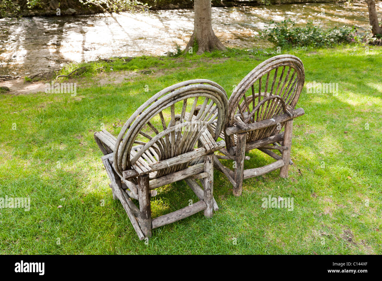 Bent willow wood chairs on lawn, Big Sur Inn, Big Sur, California Stock Photo