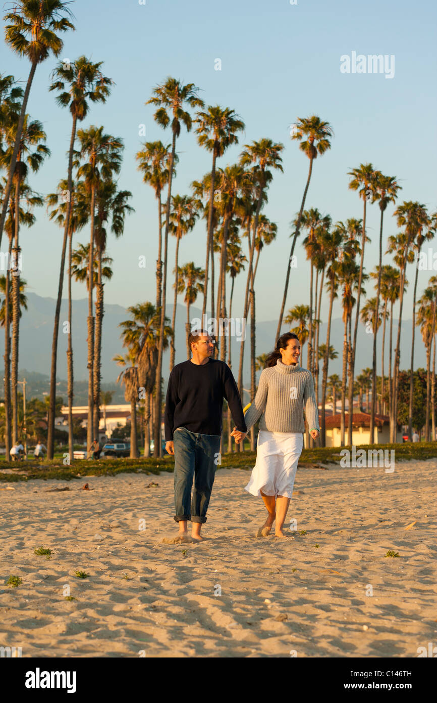 Couple walking on beach in Chase Palm Park in Santa Barbara, California. Stock Photo