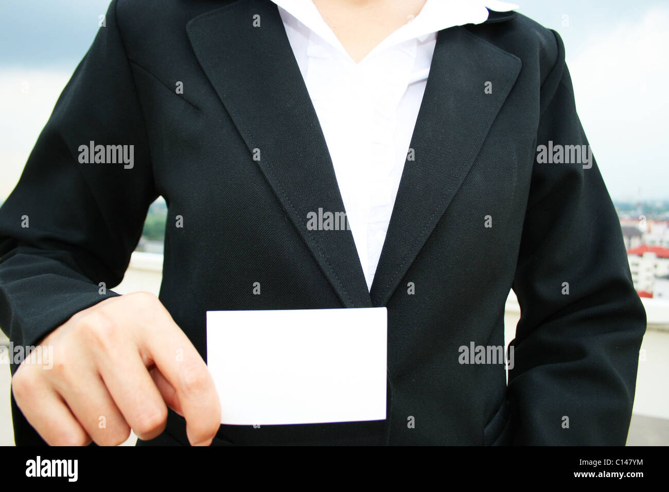 Business woman holding a business card. Stock Photo