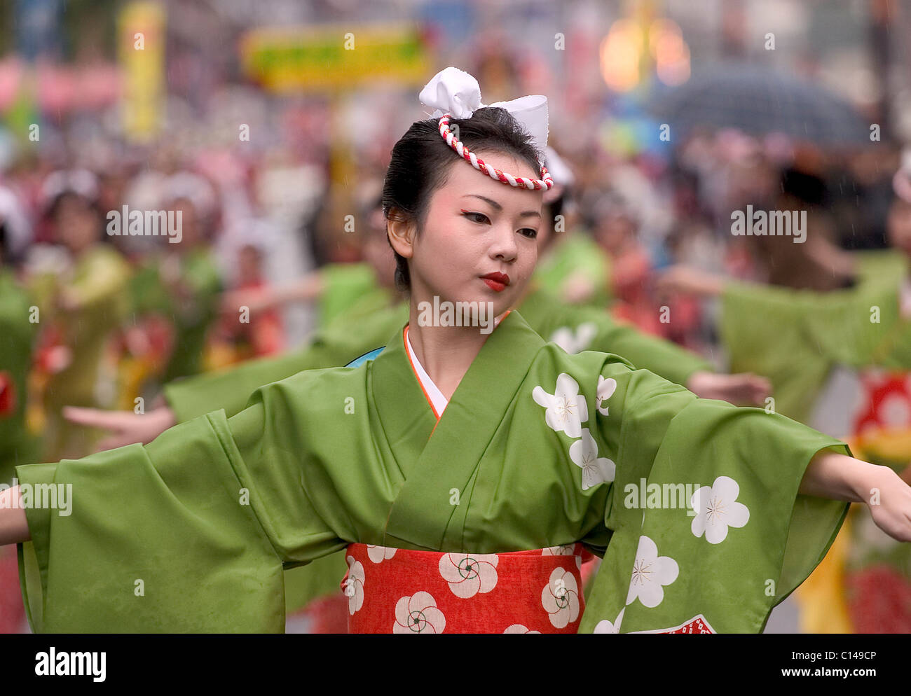 Women in green yukata kimono dancing in symmetrical lines during the Ohara  Matsuri dance festival in Kagoshima City, Japan Stock Photo - Alamy