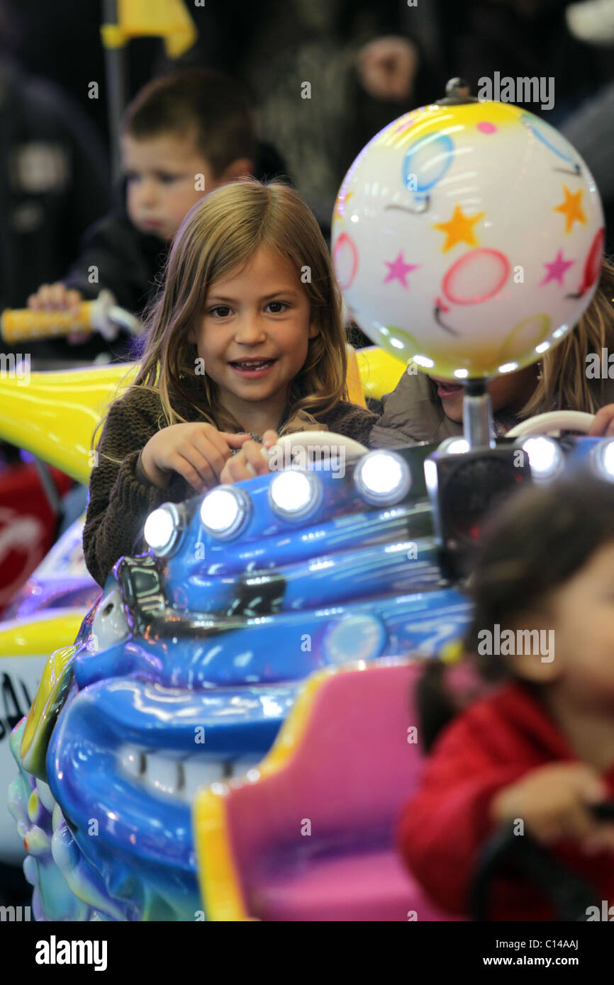 Child on funfair ride Stock Photo - Alamy