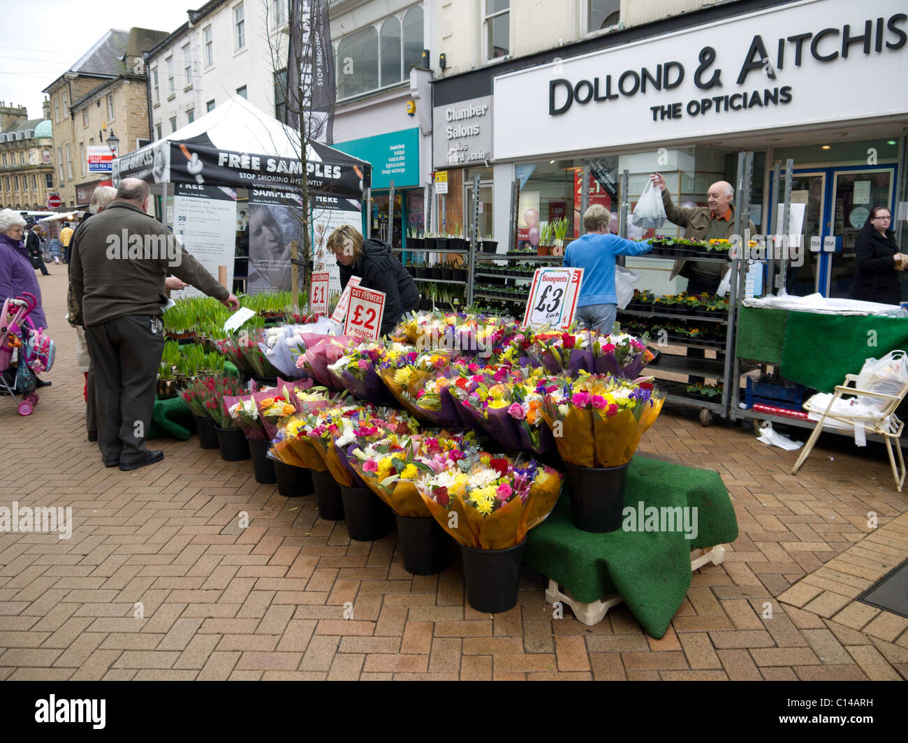 Market stall selling cut flowers and cheap bouquets Stock Photo Alamy